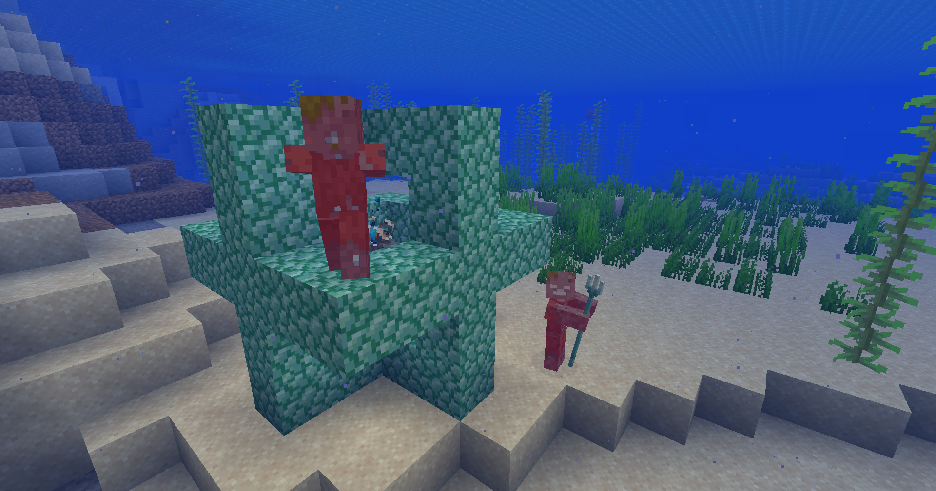 Two drowned glow red beside Torrential’s prismarine-framed conduit on a Minecraft seabed.