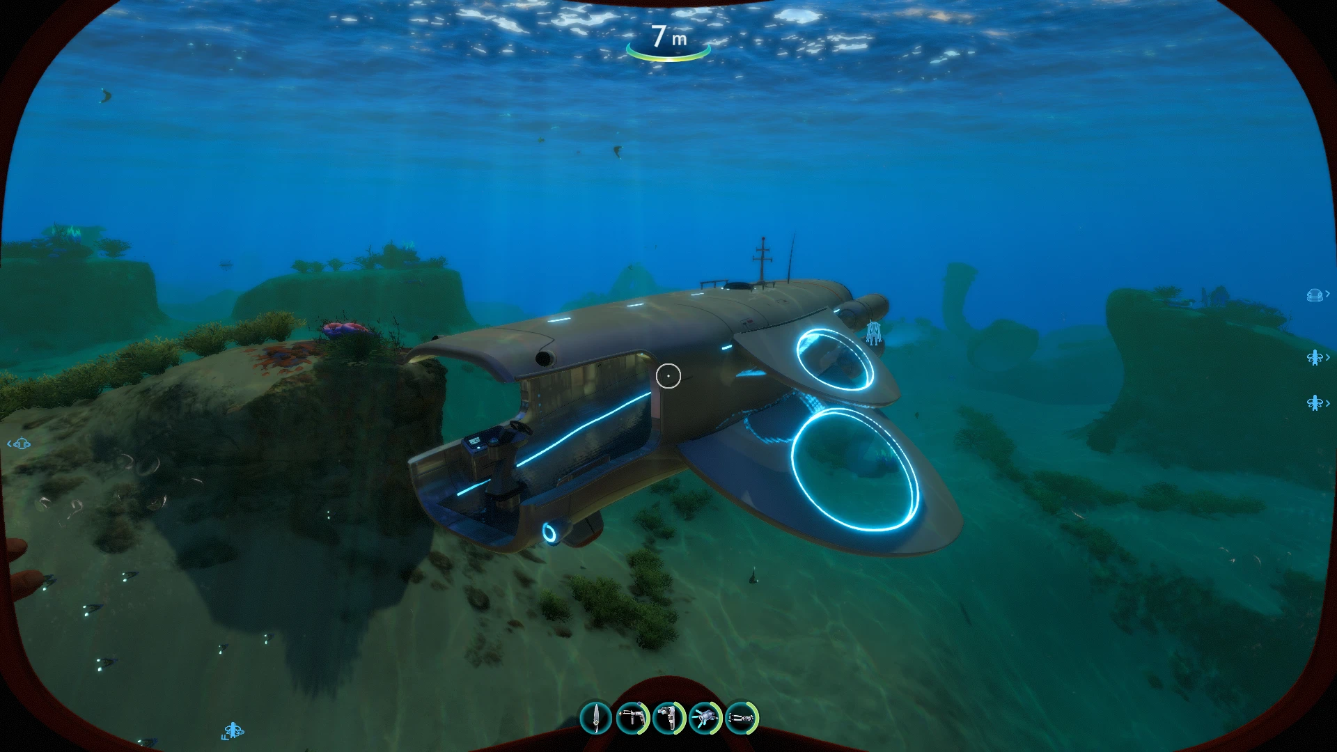 DragonFly submarine underwater, with an open front and blue-lit circular wings.