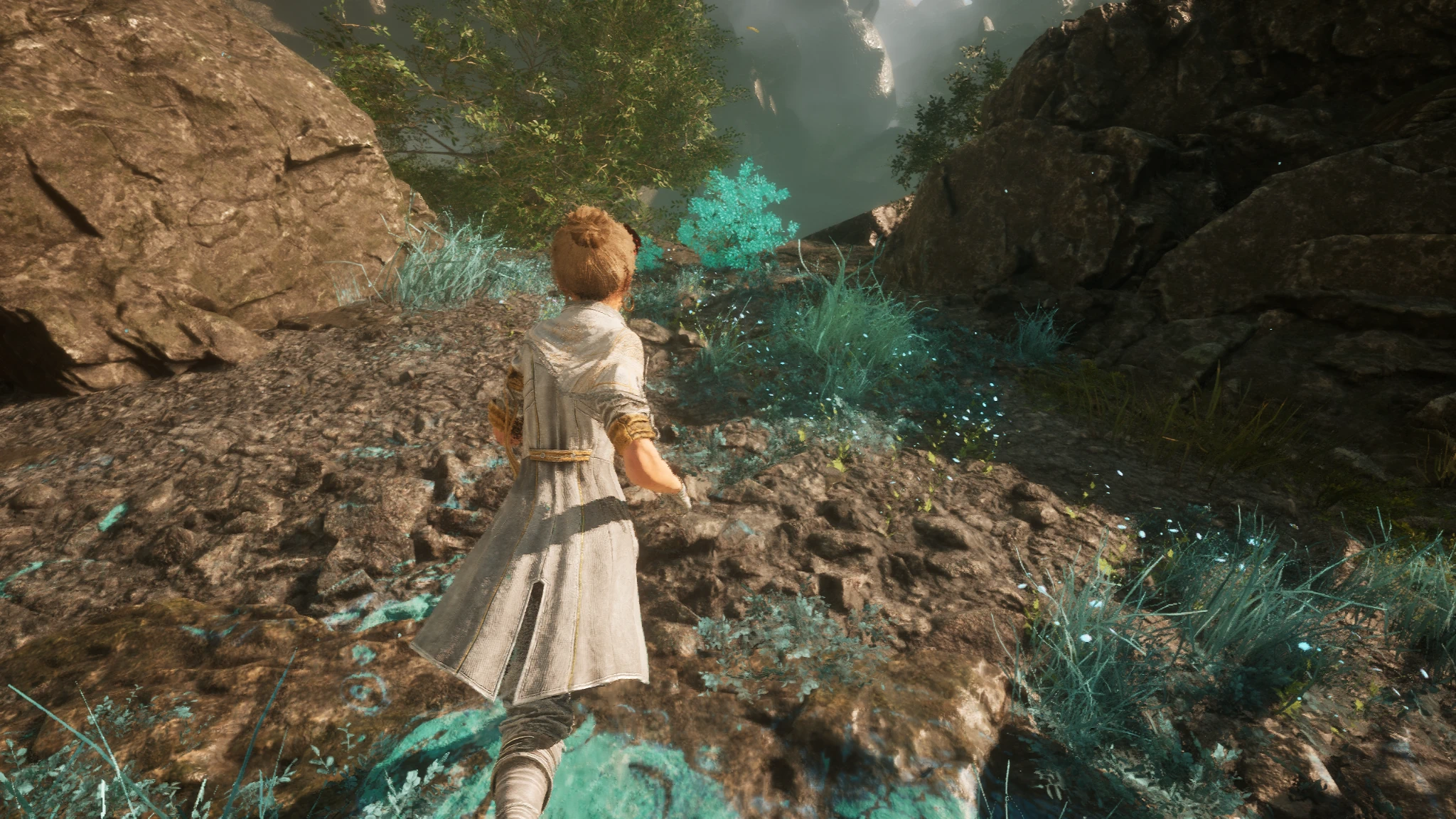 A white-coated character runs along a rocky path amid turquoise foliage in a creator-provided Clair Obscur: Expedition 33 screenshot.