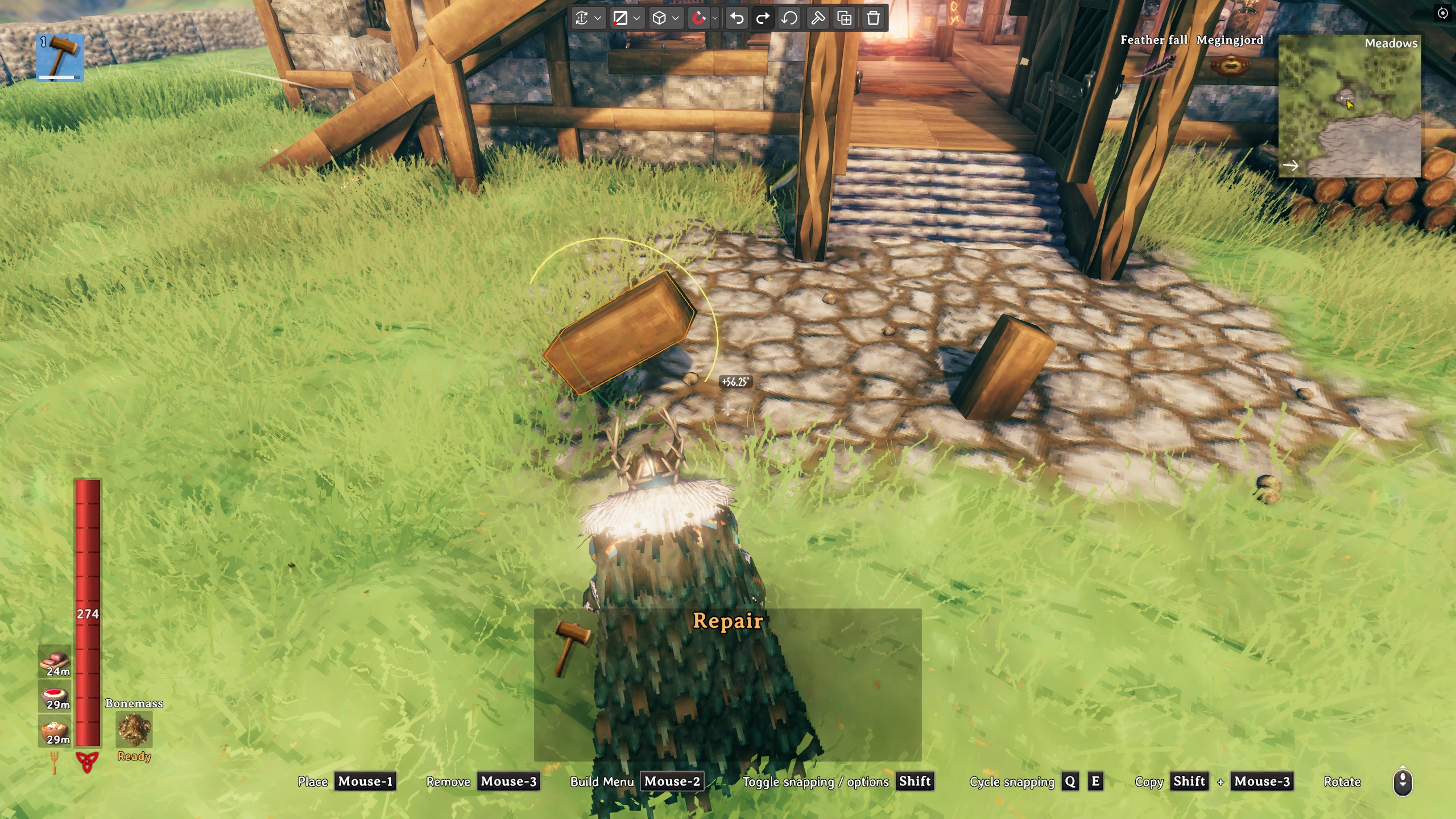 A Valheim builder rotates an outlined timber piece using Precision Move Gizmo beside a house.