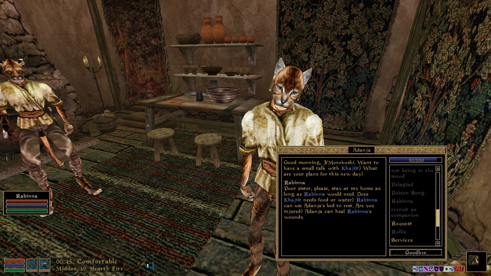 Adanja speaks with the player in a furnished Morrowind interior, with a second Khajiit seated nearby.
