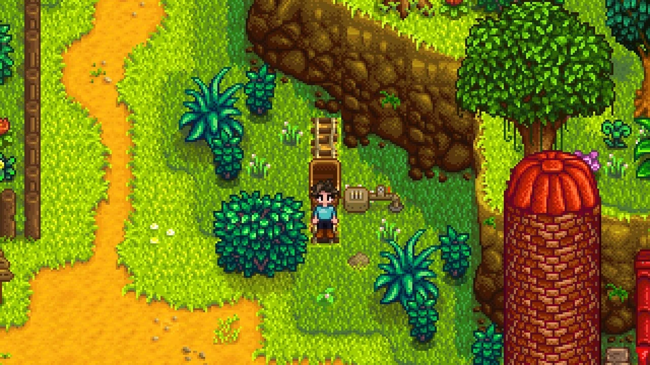The added Cindersap Forest minecart stop beside a cliff and silo in Stardew Valley.