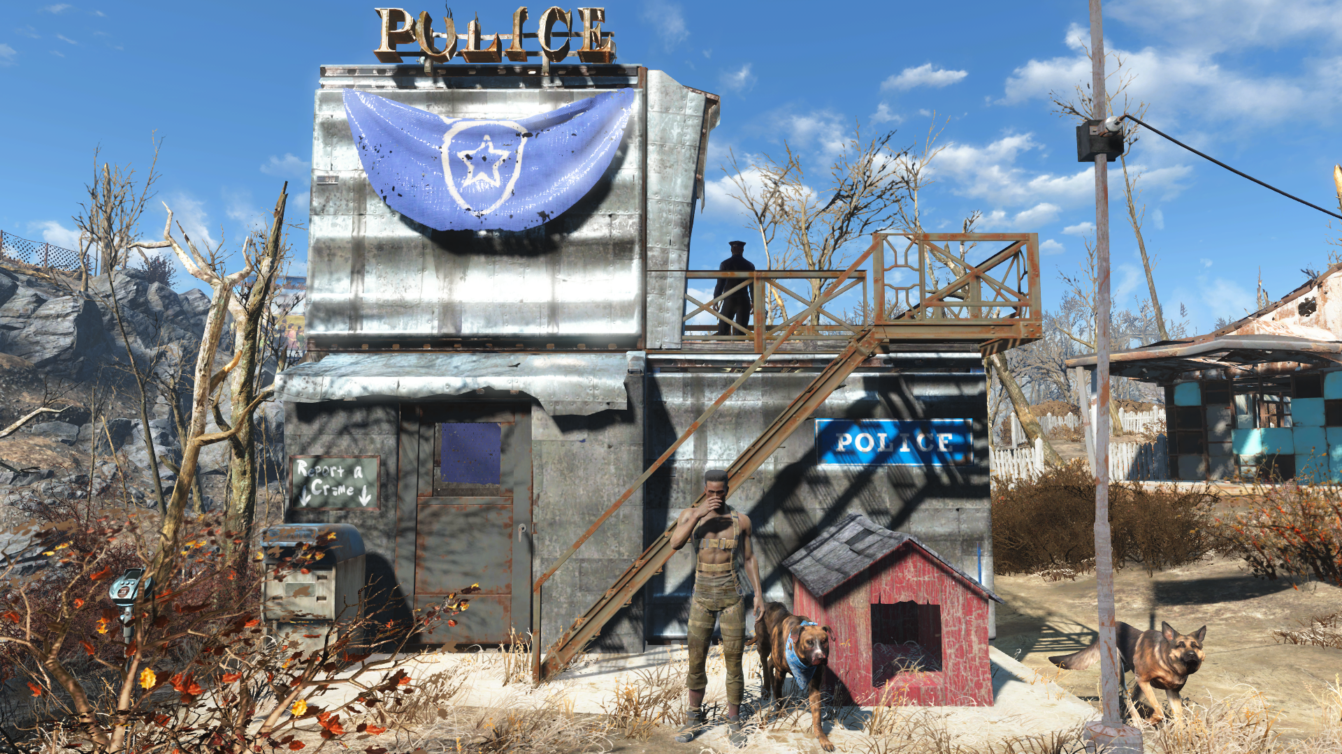 A two-story scrap-metal police station with blue CPD signs, an exterior stairway, settlers and dogs in a Fallout 4 settlement.