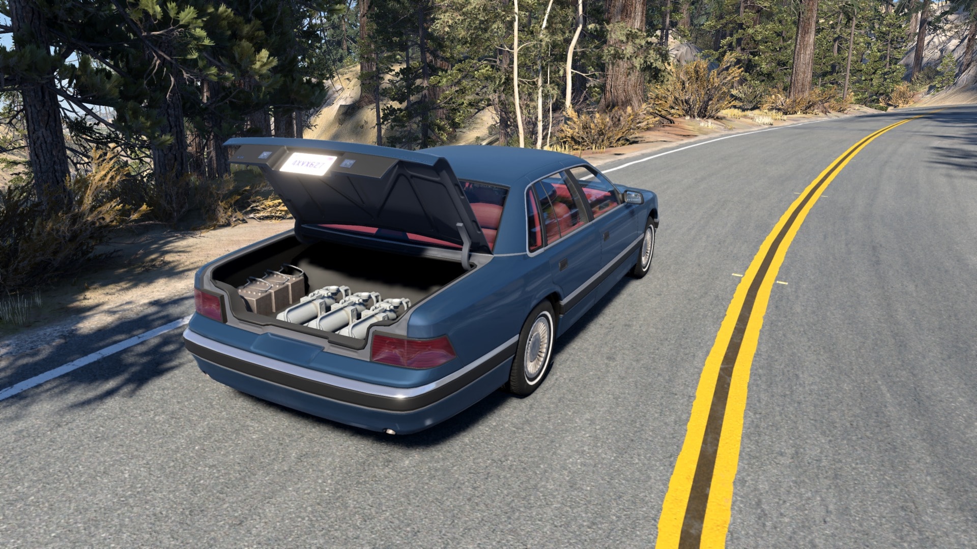 The open trunk of a blue Gavril Grand Marshal reveals HydroGlide’s pump and accumulator hardware beside a forest road.