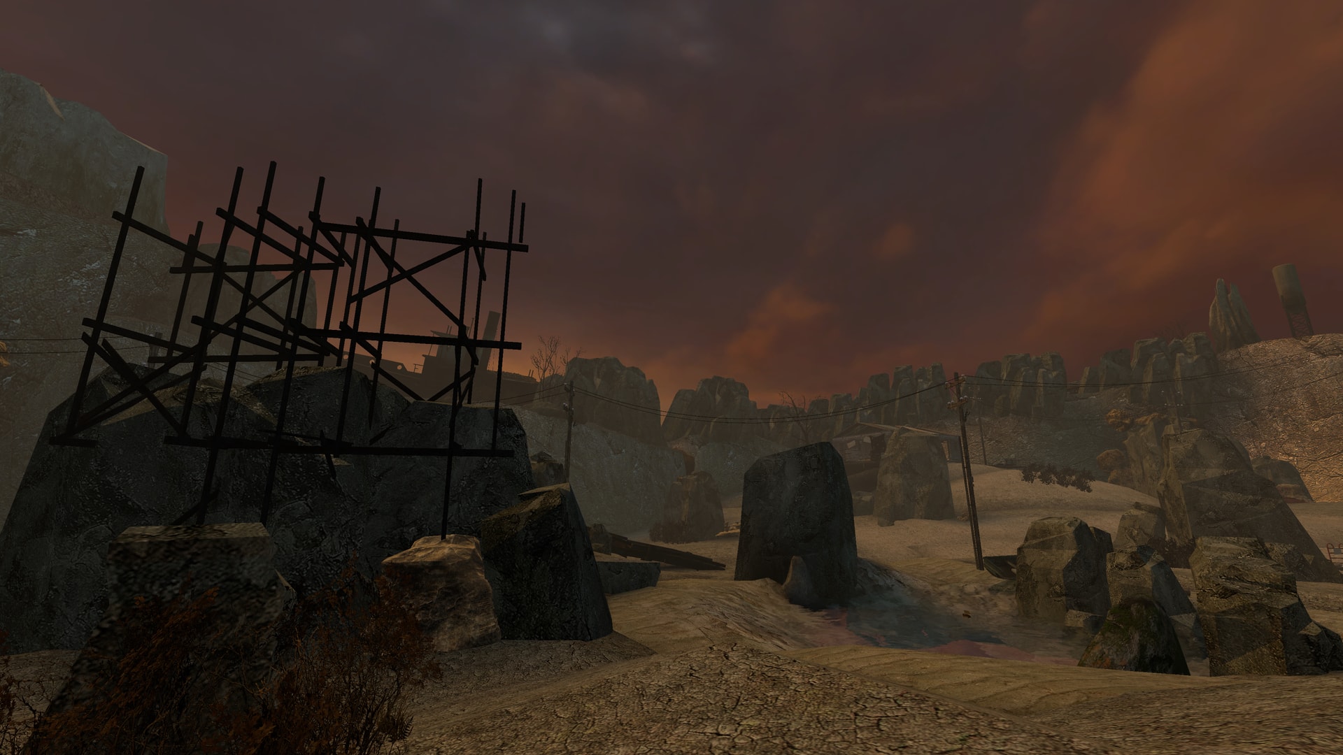 Rock formations and scaffolding under an orange sky in Raising the Bar: Arena’s Wastebowl arena.