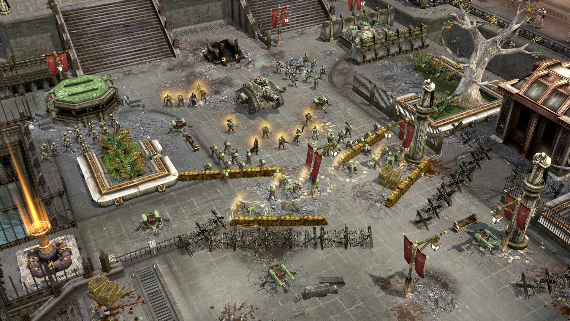 Imperial Guard infantry and green armored vehicles gather behind sandbags in a ruined city in Dawn of War II: Eternal.