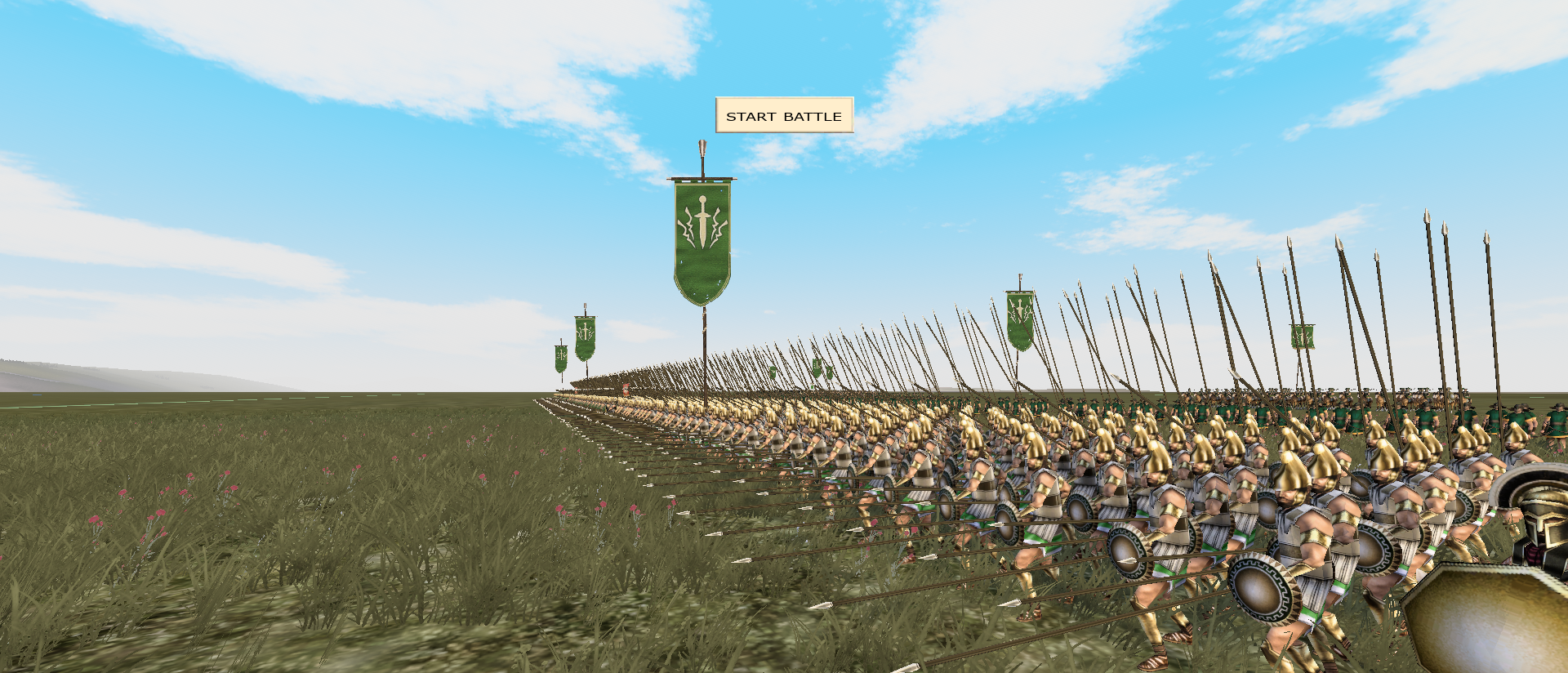 A long green-bannered phalanx deployed on a grassy battlefield in Rome Total War Vanilla Enhanced.